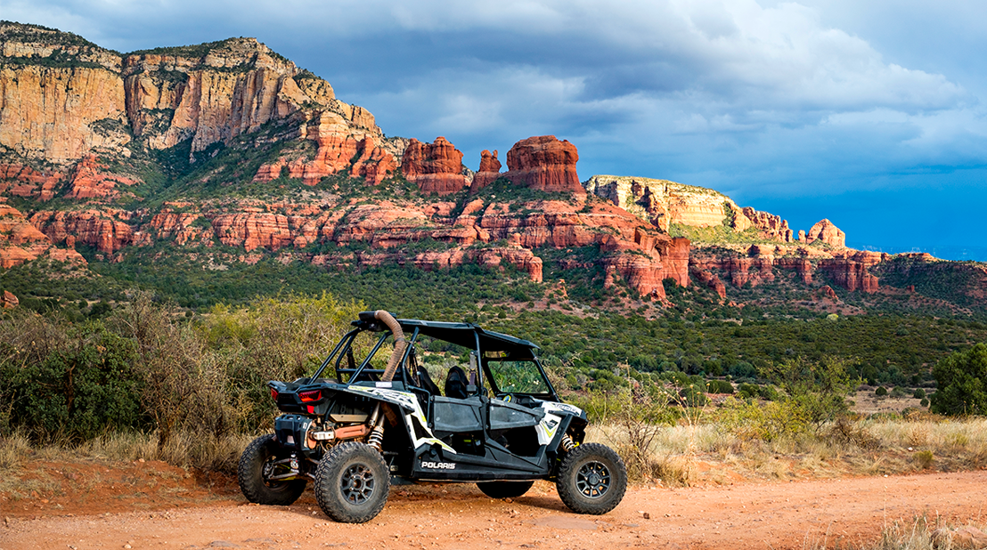 Blog 36 Motorcycle parked on the side of a dirt road in Sedona, a perfect destination for off road fun