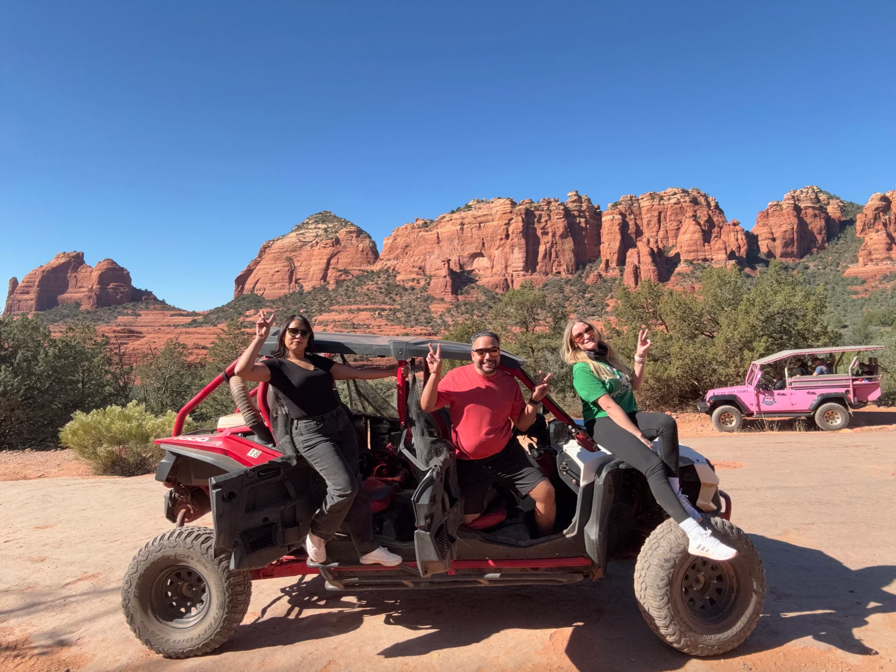 Blog 36 Three people posing funny while riding the UTV vehicle