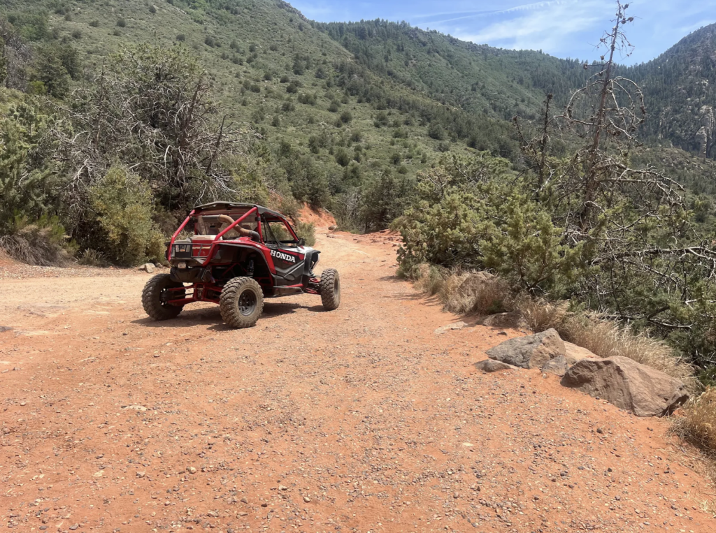 Why Choose Sedona's Only 100% Locally Owned Off-Road Adventure Company? 1 Off-road UTV navigating rocky desert trail surrounded by iconic Sedona landscapes