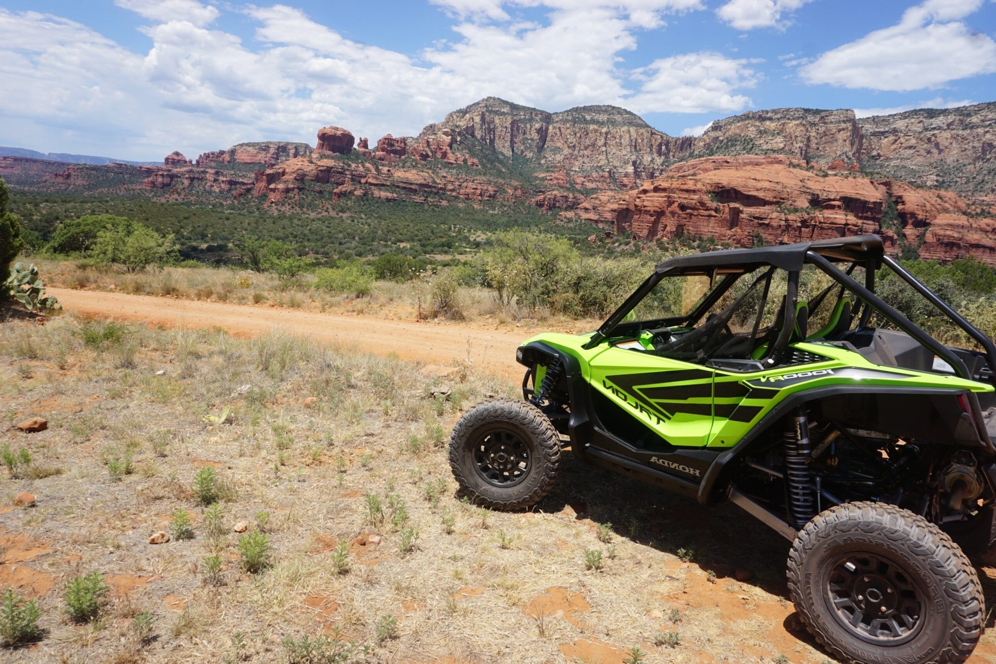 DSC04815-scaled a green truck with a mountain in the background