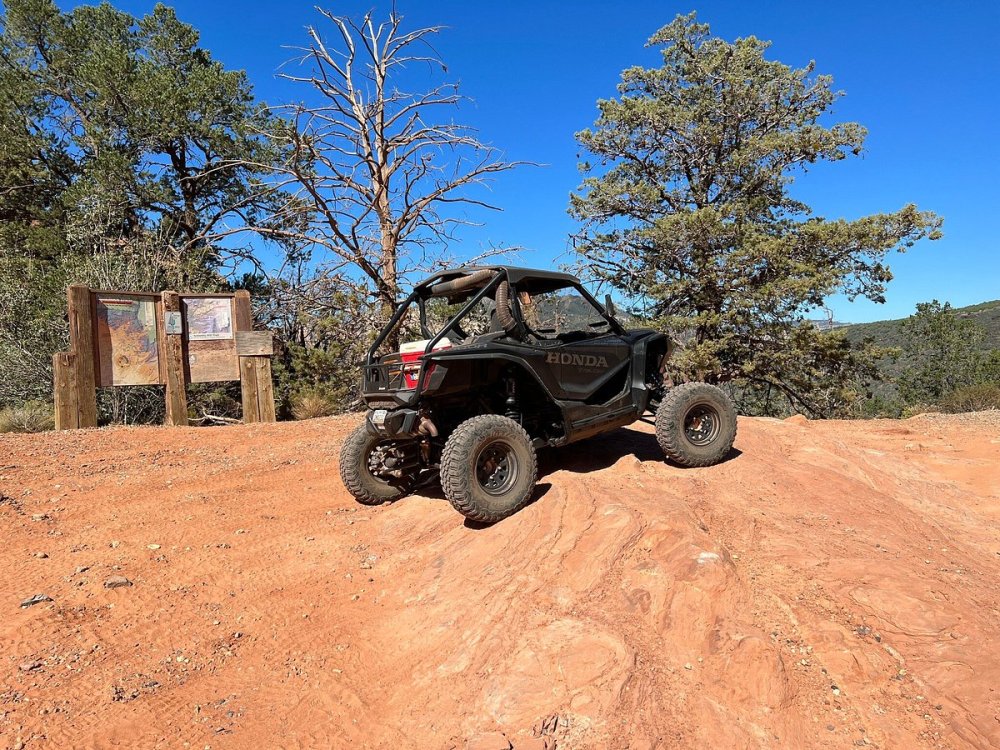 a Honda Talon driving down a dirt path in Sedona AZ